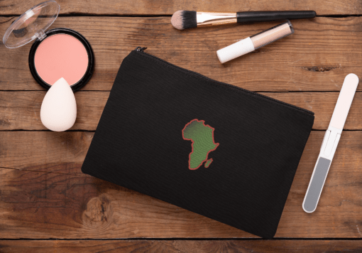 mockup of a cosmetic pouch lying on a wooden surface 29991 AFROCENTRIC EMBROIDERY DESIGNS CONTINENT