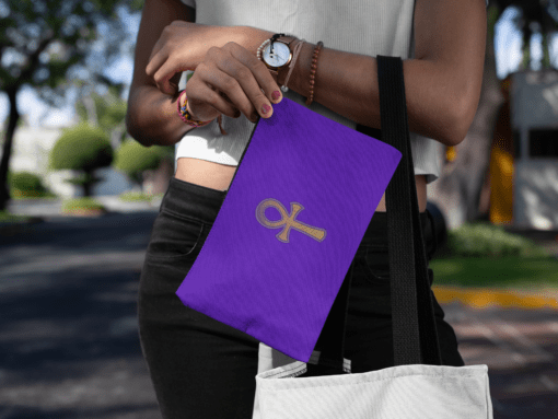 mockup of a young woman carrying a cosmetic pouch on the street 29975 AFROCENTRIC EMBROIDERY DESIGNS royal ankh