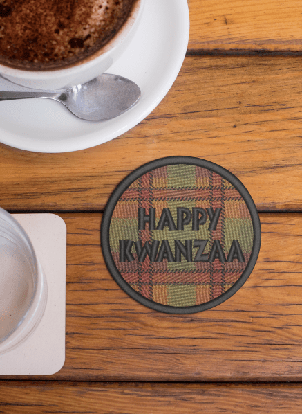 mockup of a round coaster placed next to a cup of hot chocolate 27805 AFROCENTRIC EMBROIDERY DESIGNS kwanzaa
