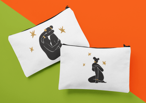 mockup of two cosmetic pouches placed over a bicolored surface 29980 AFROCENTRIC EMBROIDERY DESIGNS GODDESS