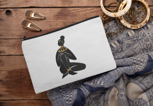 sublimated pouch mockup surrounded by hair pins and bracelets 29990 1 AFROCENTRIC EMBROIDERY DESIGNS GODDESS
