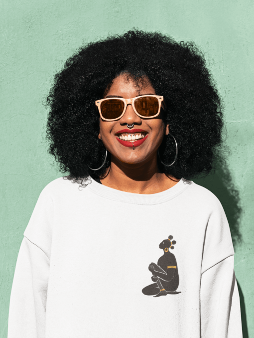 sweatshirt mockup of a happy woman with sunglasses posing against a colored wall 44676 r el2 Designs with a unique blend of culture and style. Rasta vibes, Afro futuristic, heritage and Roots & Culture. Goddess